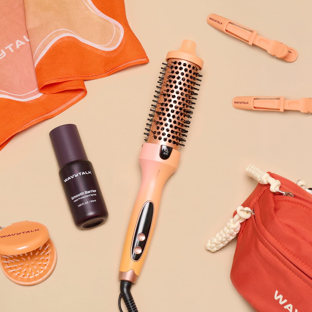 Hair styling tools including a hairbrush, bottle, and pouch on a beige background