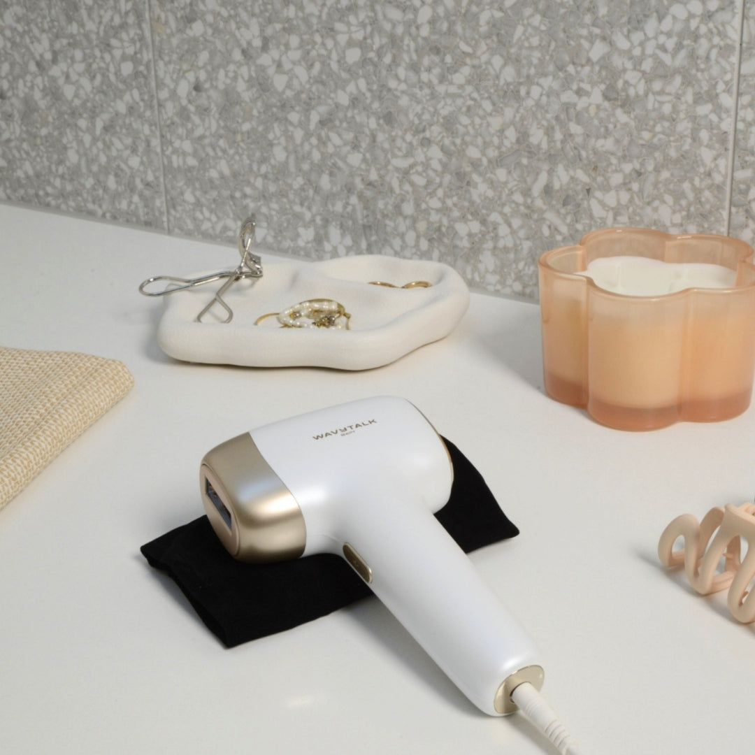 Bare It at-home hair removal device on a bathroom countertop
