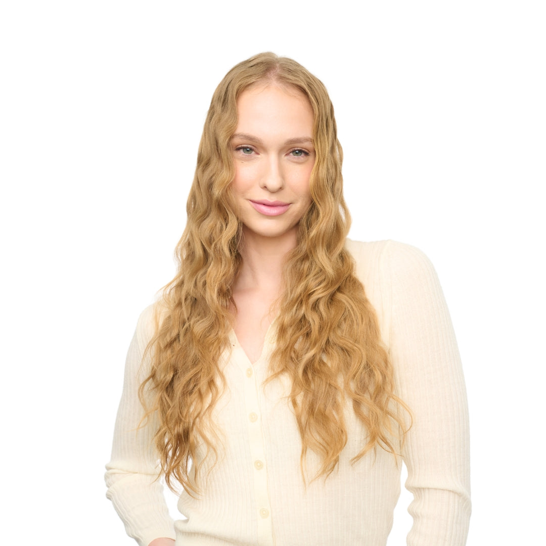 Woman with long blonde hair styled in loose beach waves using the Wavytalk Multi Curl 5-in-1 curling wand.