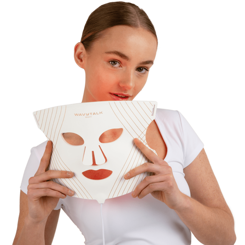 A young woman has just removed the Wavytalk Glow Time LED Therapy Mask.