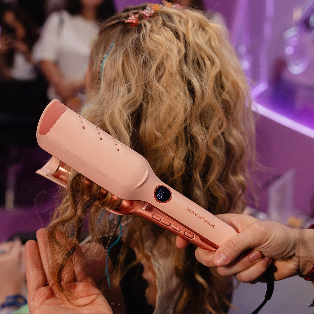Wavytalk pink hair styling tool creating defined waves on blonde curly hair