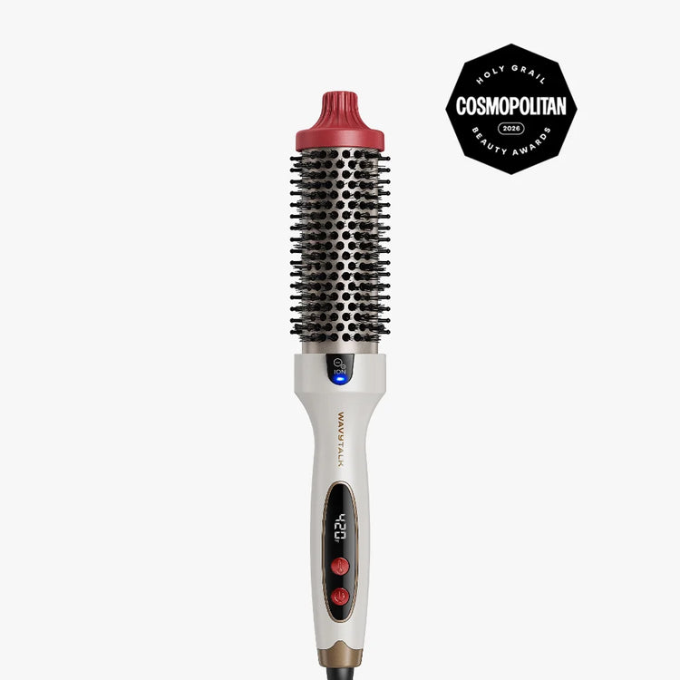 A W20 WANDPRO round hair styling brush with a white handle, black bristles, a red top cap, and a digital temperature display, shown on a light gray background with a Cosmopolitan Beauty Awards seal in the top right corner.