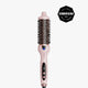 A pink and black round hair styling brush with digital temperature control, shown vertically on a light gray background with a black Cosmopolitan Beauty Awards badge in the top right corner.
