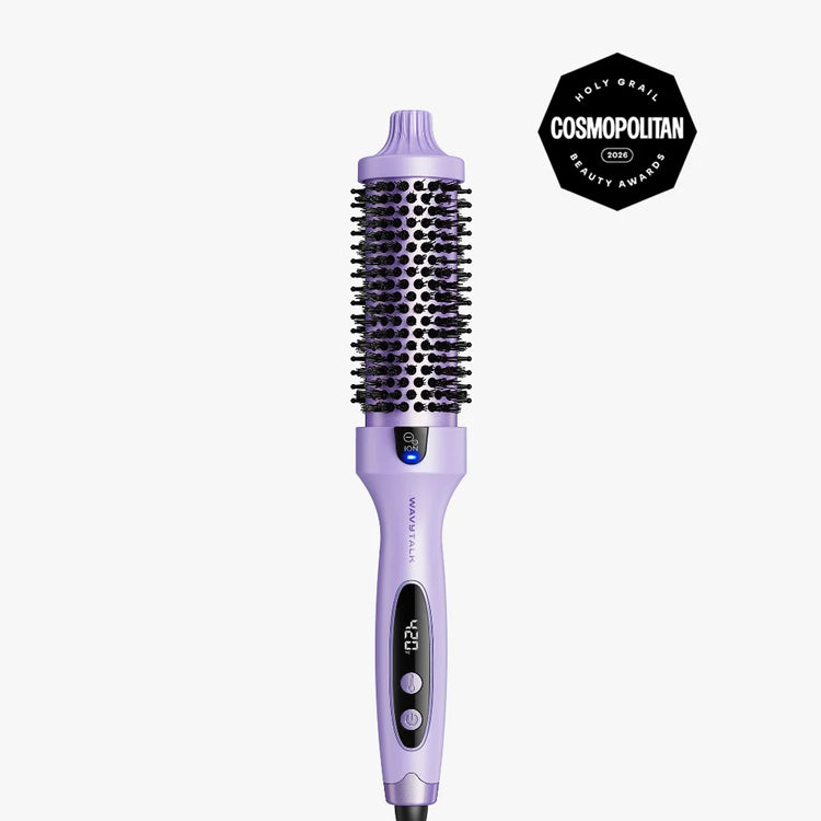 A lavender purple hot air brush with a digital display and three buttons, shown against a light gray background with a black Cosmopolitan Beauty Awards badge in the top right corner.