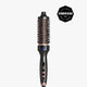 A hot air brush styling tool with a black handle and rose gold barrel, shown vertically against a light gray background with a Cosmopolitan Beauty Awards badge in the top right corner.