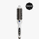 A white and black round hairbrush styling tool with a digital temperature display, shown vertically on a light gray background with a black Cosmopolitan Beauty Award badge in the top right corner.