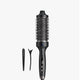 Black hair styling tool with attachments on a white background
