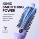 Purple Blowout Boost Hair styling tool with blue bristle head on a light purple background, featuring text about ionic smoothing power.