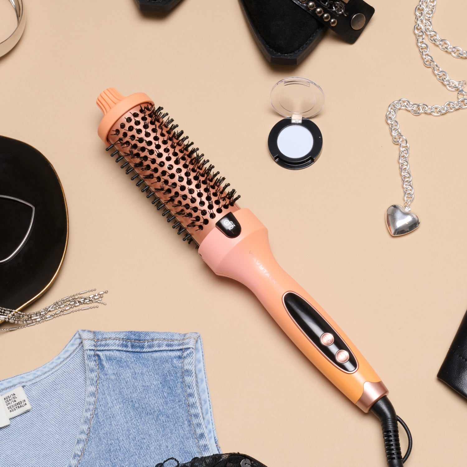 Wavytalk thermal round brush in peach and rose gold flat lay with denim vest and fashion accessories