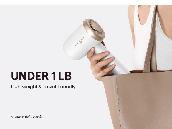 Hand holding a white turblow pro hair dryer with gold accents, labeled 'Under 1 LB' on a white background.