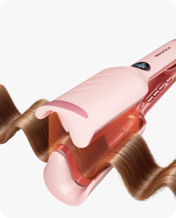 Pink hair straightener with wavy hair on a white background