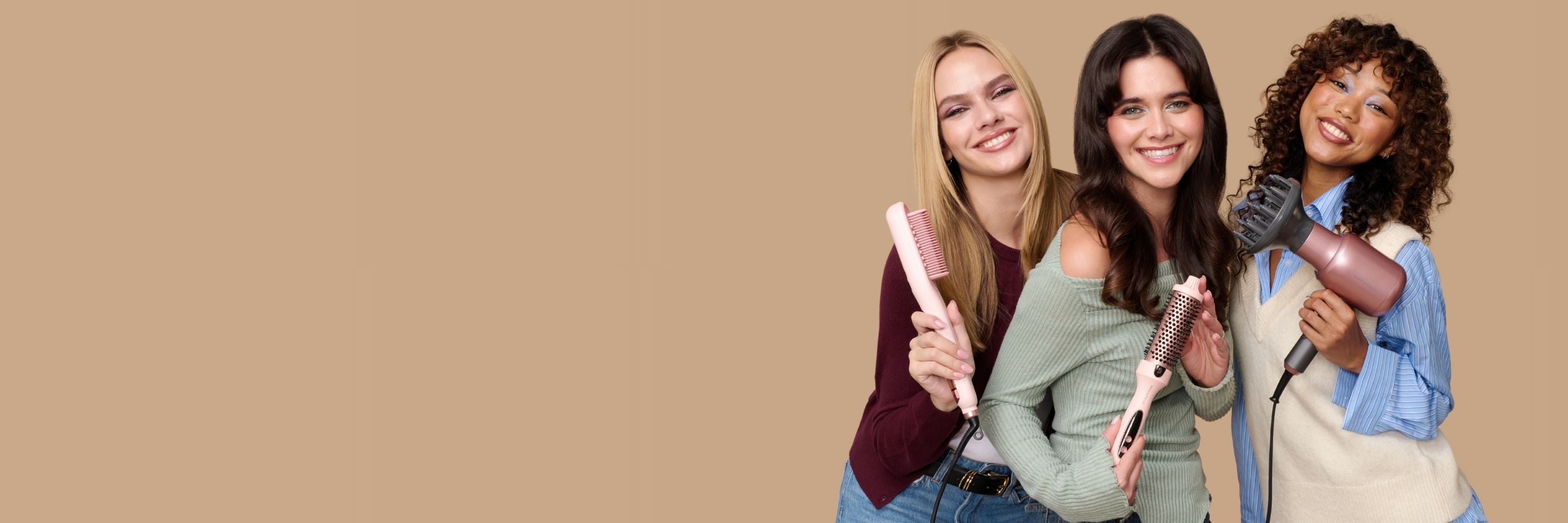 Three women holding hair styling tools against a beige background